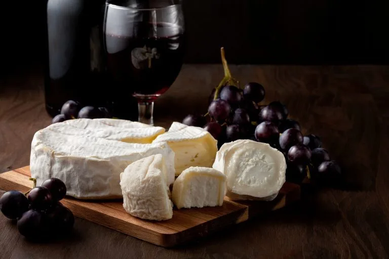 variety-of-different-cheese-with-wine-and-fruits